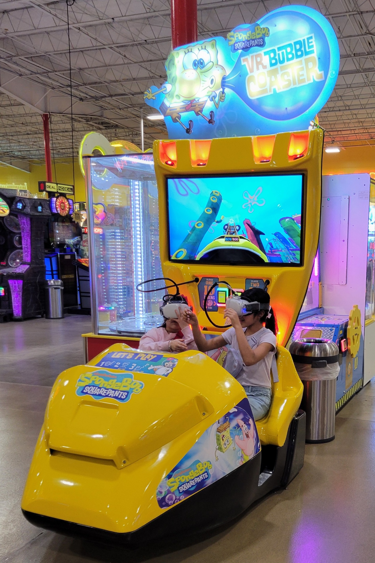 Kids wearing VR headsets on the SpongeBob VR Bubble Coaster