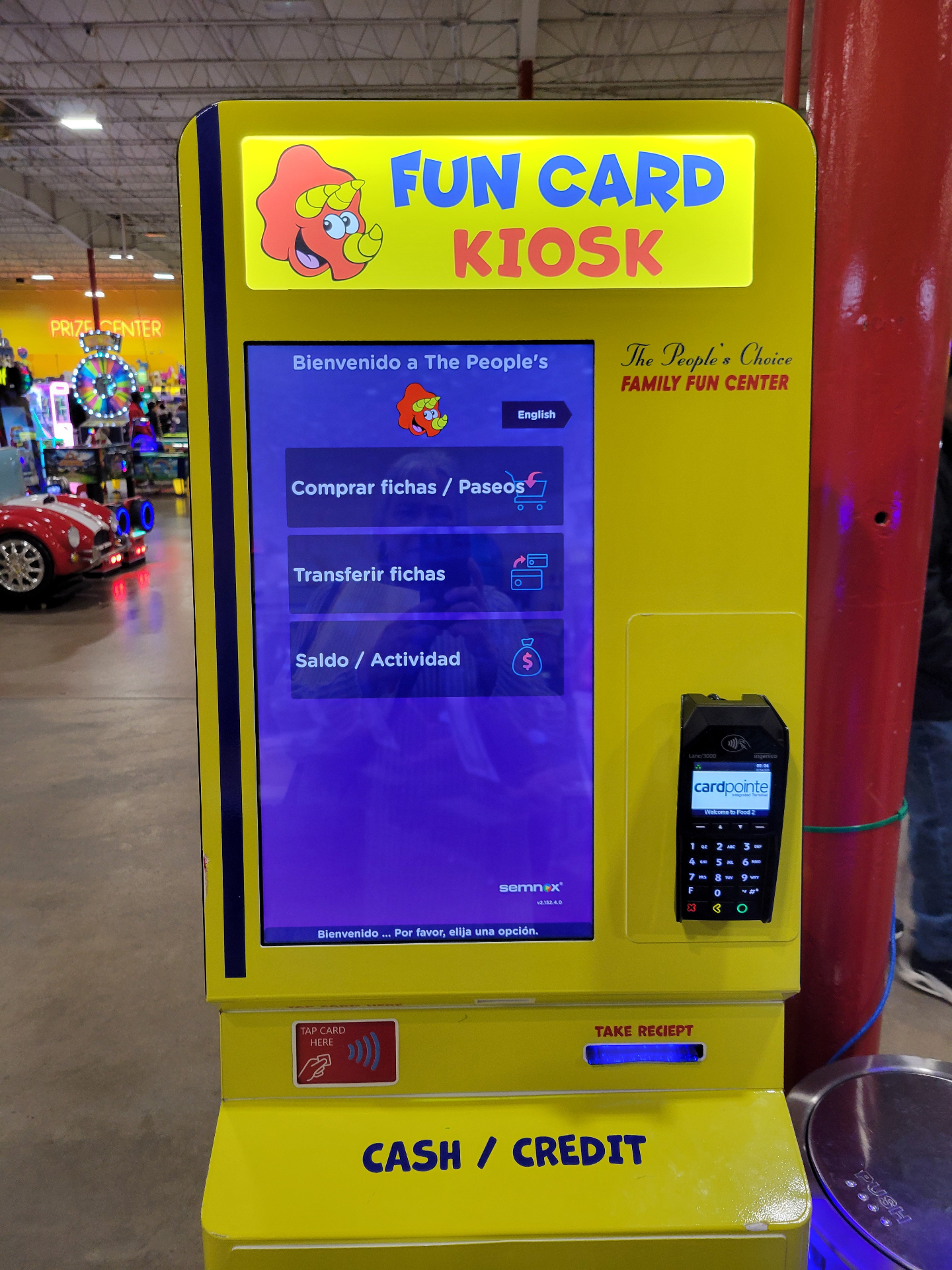 The yellow Fun Card kiosk where guests buy tokens
